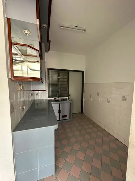 Kitchen features: grey tiled countertops, wooden upper cabinets with glass doors, white tiled walls, pink and grey patterned floor tiles, single-basin sink, built-in cabinet, fluorescent ceiling light, open layout, no visible appliances.