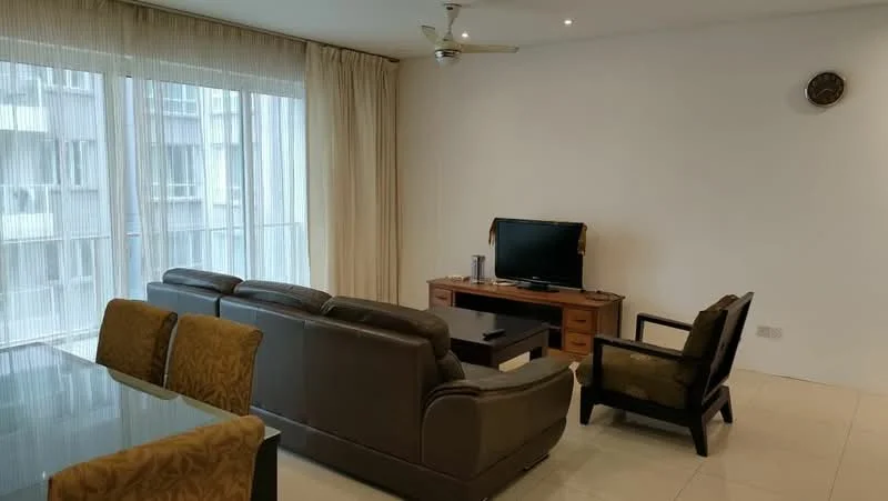 Living features: 3-seater leather sofa in dark brown, 2-seater fabric armchair in green, coffee table, TV console, wall-mounted TV, floor-to-ceiling windows with sheer curtains, light-colored walls, recessed downlights, ceiling fan, tile flooring, decorative wall clock; style: modern.