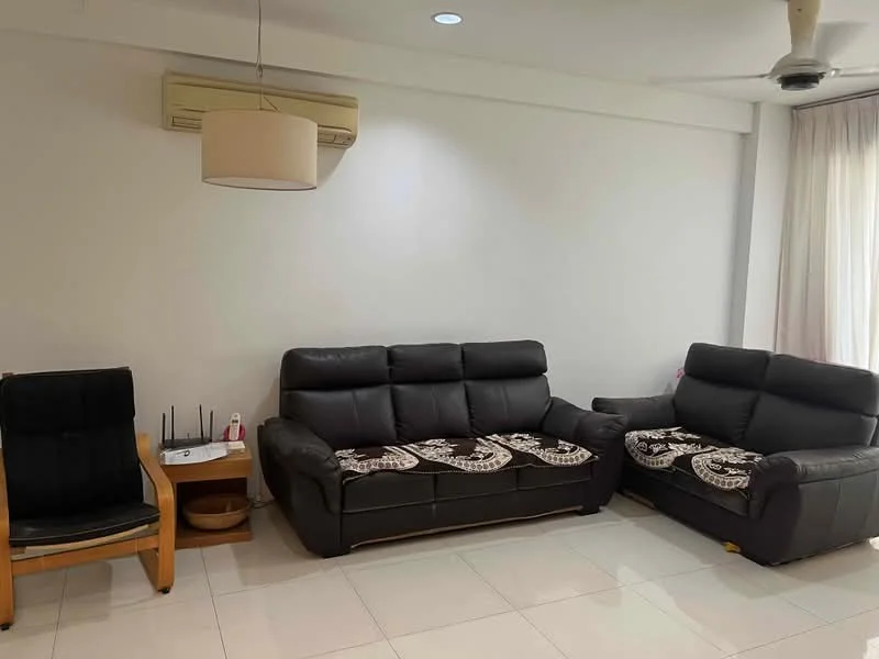 Living features: 2-seater leather sofa in black, 3-seater leather sofa in black, wooden armchair, ceiling fan, wall-mounted air conditioning unit, white painted walls, tile flooring, curtains, side table, decorative items on side table; style: modern.
