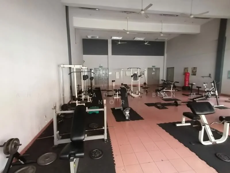 Room features: exercise equipment, weight benches, free weights, treadmill, exercise mats, ceiling fans, pink tiled flooring, mirrored wall, wall-mounted mirrors, open layout, high ceilings, windows for natural light; style: modern.