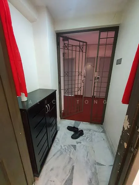 Room features: marble flooring, black storage cabinet with drawers, metal security gate, red curtains, light-colored walls, door leading to another room; style: modern.