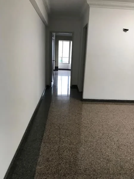 Room features: white painted walls, granite flooring, natural light from windows, doorway leading to another room, baseboards, ceiling with crown moulding; style: modern.