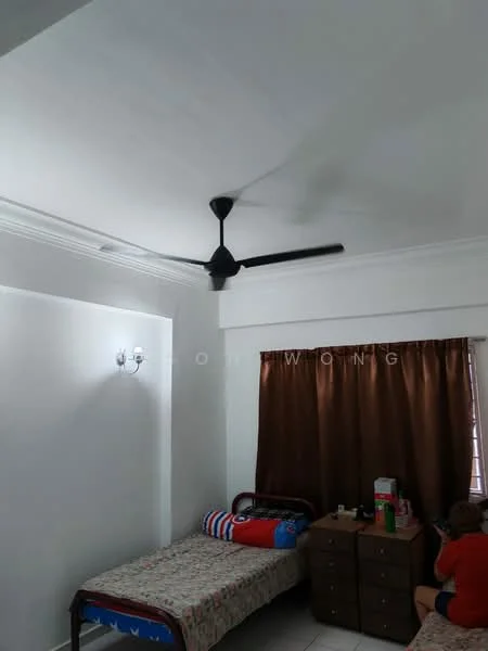 Bedroom features: white painted walls, tray ceiling, 5-blade ceiling fan in black, brown curtains, two single beds with patterned bedding, wooden bedside table, decorative wall sconce, tile flooring.
