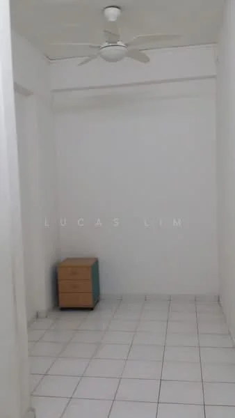 Room features: white painted walls, white tiled flooring, ceiling fan, small wooden dresser, empty space; style: minimalist.