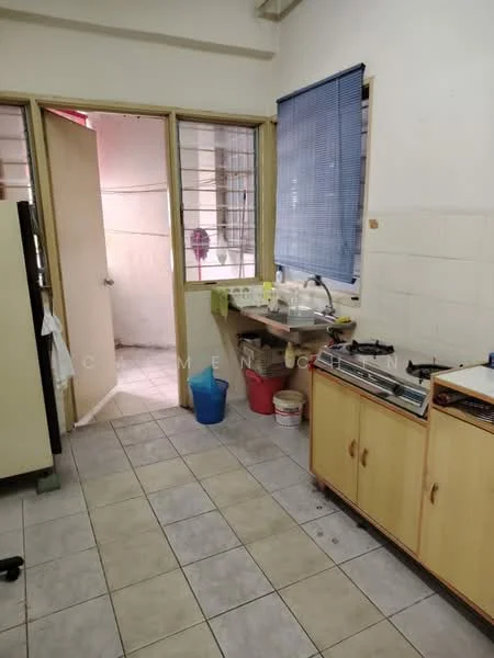 Kitchen features: tile flooring, white walls, wood cabinetry, stainless-steel sink, gas stove, window with blue blinds, countertop space, open doorway to adjacent room.