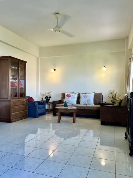 Living features: white painted walls, ceramic tile flooring, 5-blade ceiling fan, sofa with cushions, wooden coffee table, wooden display cabinet, decorative plants, wall-mounted lights, large window with natural light; style: traditional.
