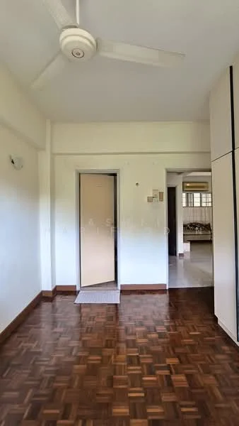 Room features: wooden flooring, white painted walls, ceiling fan, doorway leading to another room, window with natural light, light switch, built-in wardrobe, baseboard trim.