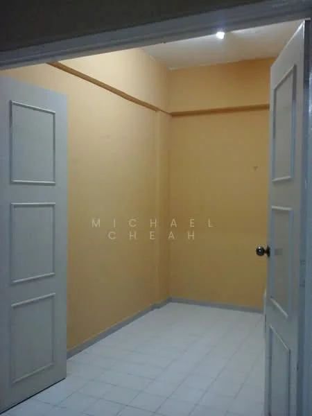 Room features: orange painted walls, white tiled flooring, two-panel doors, ceiling light fixture, corner room, no visible windows, plain ceiling.