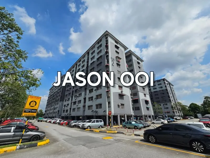 Exterior type: low-rise apartment block; features: grey painted facade, multiple balconies, parking lot with marked spaces, surrounding trees, urban setting, 2-storey building, visible car parking, signage for parking regulations; style: modern.