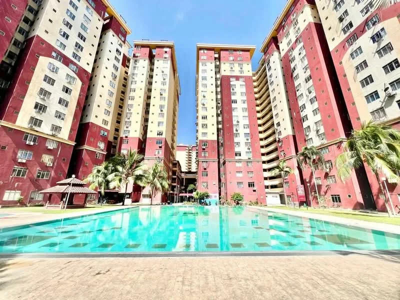 Exterior type: high-rise condominium; features: multiple high-rise buildings, red and cream painted facade, swimming pool, pool deck with loungers, landscaped garden area, palm trees, gazebo, surrounded by greenery; style: modern.