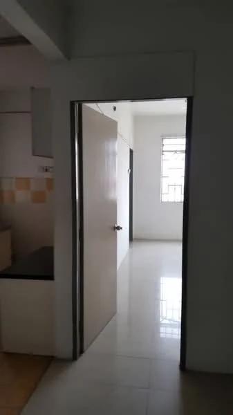 Room features: white painted walls, tile flooring, doorway, window with grid, kitchen area visible, light source from window.