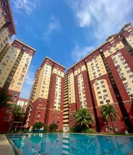 Exterior type: high-rise condominium; features: red and cream painted facade, multiple storeys, balconies on upper floors, large windows, swimming pool in foreground, palm trees in landscaping, manicured lawn, surrounding greenery, clear blue sky; style: modern.