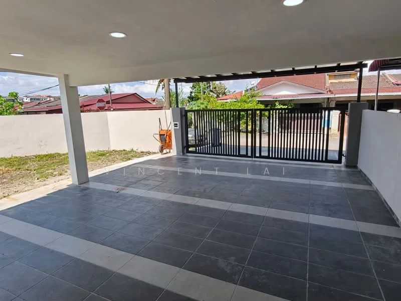 Exterior type: car porch; features: paved flooring with grey tiles, open space, metal gate, surrounding wall, outdoor lighting, landscaped area, adjacent residential buildings; style: modern.