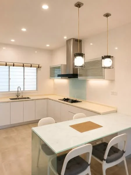Kitchen features: white cabinetry, marble countertop, stainless-steel sink, chrome pull-down faucet, built-in gas hob, stainless-steel range hood, pendant lighting, glass dining table, white dining chairs, tile flooring, window with blinds, light-colored backsplash; style: modern.