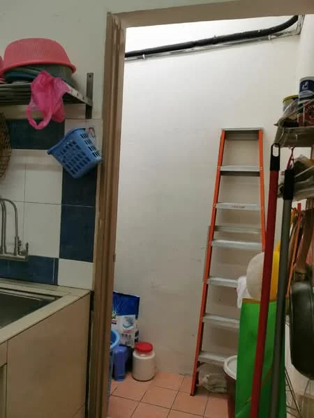 Laundry features: single-bowl stainless-steel sink, wall-mounted faucet, white tiled walls, blue accent tiles, orange ladder, plastic storage containers, cleaning supplies, pink plastic bag, blue laundry basket, pink hat, tile flooring.