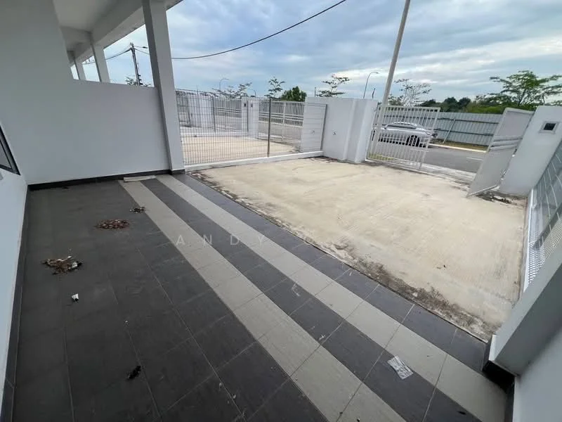 Exterior features: paved flooring, concrete driveway, metal gate, fenced perimeter, open space, surrounding greenery, partially covered area, grey and white color scheme; style: modern.