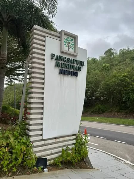 Exterior features: signage with the name 'Pangsapuri Meridian Medini', landscaped greenery, paved walkway, road access, surrounding hills, palm trees, decorative plants; style: modern.