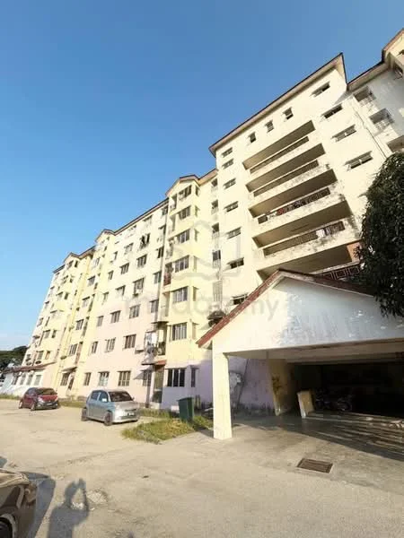 Exterior type: low-rise apartment block; features: cream painted facade, balconies on upper floors, multiple windows, ground-level parking area, flat roof, surrounded by paved driveway, two-storey structure, visible parking spaces; style: traditional.