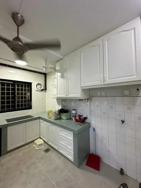 Kitchen features: white cabinetry with handles, grey countertop, single-bowl stainless-steel sink, chrome pull-down faucet, wall-mounted fan, tile backsplash, ceramic tile flooring, window with black grille, built-in storage cabinets, kitchen appliances storage area; style: modern.