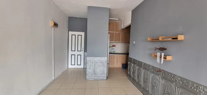 Room features: grey painted walls, white tiled flooring, wall-mounted air conditioning unit, wooden cabinetry, black countertop, white door with panel design, decorative wall paneling, open layout, kitchen area visible; style: modern.