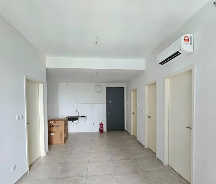 Room features: light grey painted walls, cream tiled flooring, 1 wall-mounted split AC, 1 door with a grey finish, 2 doors with white finish, kitchenette area with sink, fire extinguisher, cardboard box, ceiling lights, no visible furniture; style: modern.