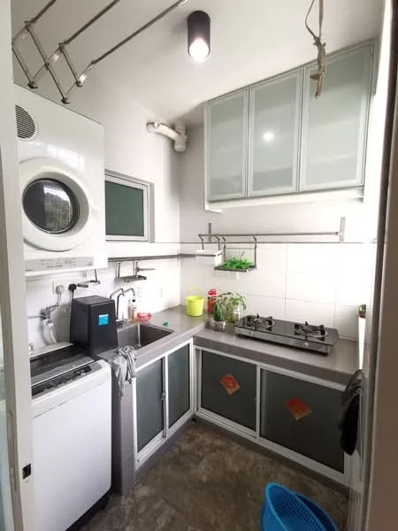 Kitchen features: single-bowl stainless-steel sink, chrome pull-down faucet, gas stove with two burners, built-in washing machine, grey laminate countertop, white tiled backsplash, upper cabinets with glass doors, open shelving, grey cabinet doors, concrete flooring, wall-mounted drying rack, window for natural light; style: modern.