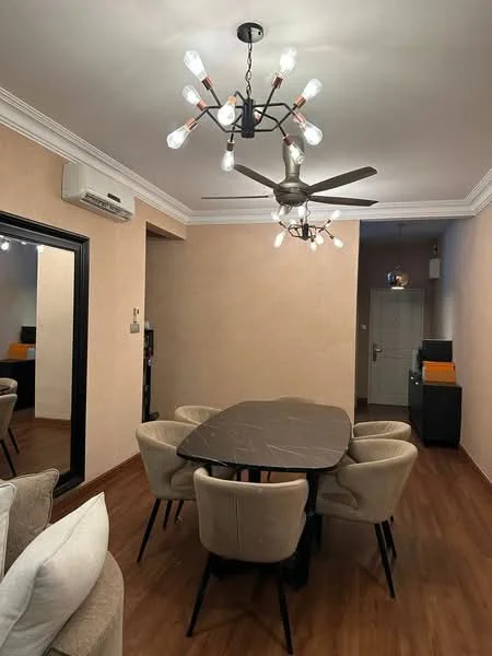 Dining features: oval dining table, 6 upholstered dining chairs, chandelier with exposed bulbs, ceiling fan with light, cream painted walls, wooden flooring, large mirror on wall, air conditioning unit on wall; style: modern.
