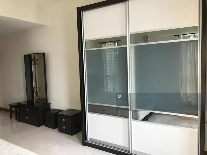 Bedroom features: built-in wardrobe with sliding glass doors, white walls, tile flooring, mirror on dresser, black bedside tables, window with sheer curtains, ceiling light fixture; style: modern.