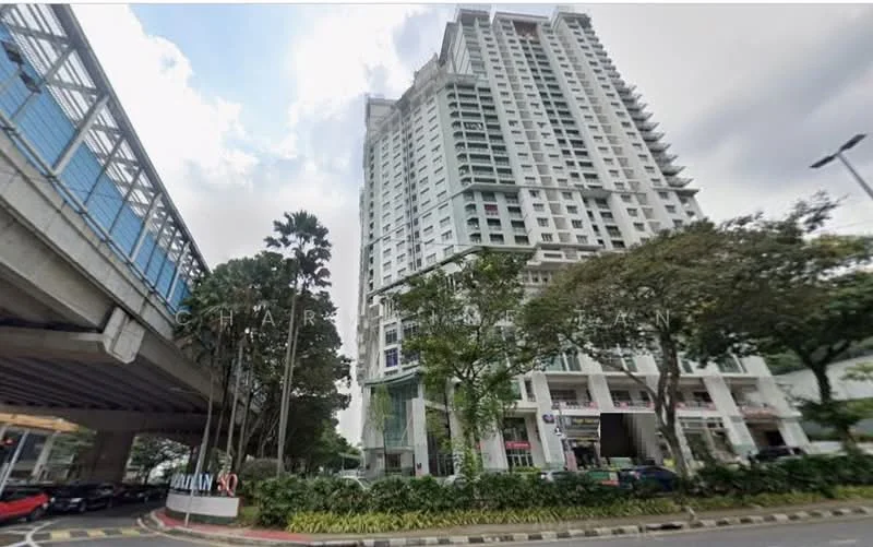 Exterior type: high-rise condominium; features: glass curtain wall, white painted facade, recessed balconies, landscaped garden at base, paved walkway, surrounded by mature greenery, adjacent to elevated roadway; style: modern.