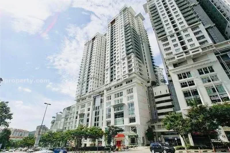 Exterior type: high-rise condominium; features: glass curtain wall, white painted facade, recessed balconies, vertical fins, multiple storeys, surrounded by mature greenery, urban context with main road, parking area visible; style: modern.