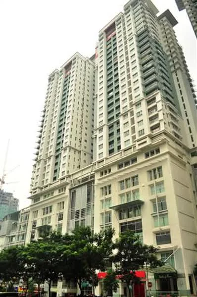 Exterior type: high-rise condominium; features: glass curtain wall, white painted facade, recessed balconies, multiple storeys, commercial units at ground level, surrounded by greenery; style: modern.