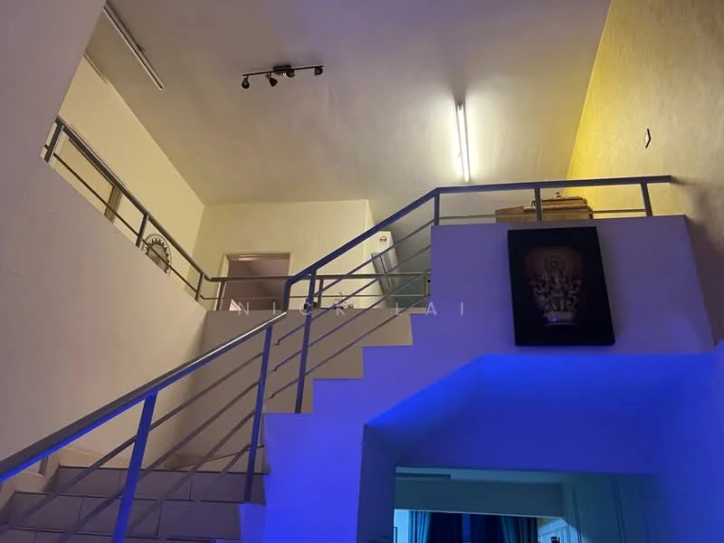 Room features: staircase with metal railing, white painted walls, yellow accent wall, recessed lighting, blue LED lighting, open space layout, high ceiling, wooden storage cabinet; style: modern.
