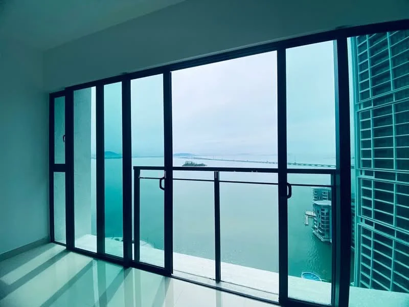 Room features: floor-to-ceiling windows, sliding glass door, sea view, white walls, glossy tile flooring, balcony railing; style: modern; view: sea.