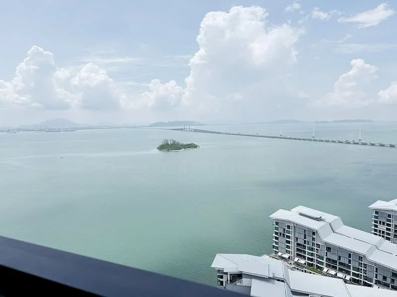 Exterior type: high-rise condominium; features: view of the sea, island in the distance, bridge visible, surrounding water, cloudy sky, modern architectural design of the building; style: modern.