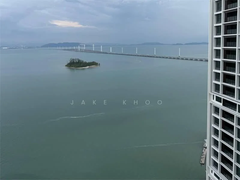 Exterior type: high-rise condominium; features: waterfront view, island view, bridge in the distance, cloudy sky, calm water surface; style: modern.