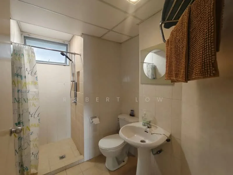 Bathroom features: white tiled walls, cream tiled flooring, walk-in shower with glass partition, chrome shower head, round mirror, white pedestal sink, toilet, towel rack, hanging towels, window for natural light, shower curtain with colorful pattern; style: modern.
