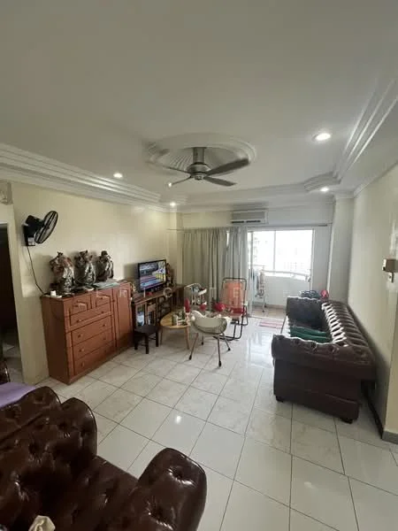 Living features: cream painted walls, white ceiling with crown moulding, 5-blade ceiling fan with light, marble tile flooring, brown leather chesterfield sofa, wooden TV console, wall-mounted TV, decorative figurines on cabinet, large window with sheer curtains, coffee table, area rug, air conditioning unit; style: modern; view: city.