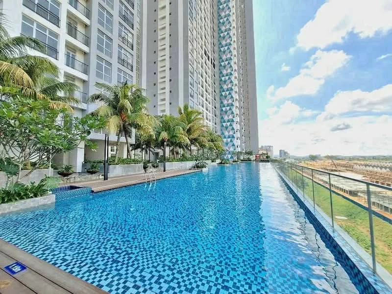 Exterior type: high-rise condominium; features: infinity pool, pool deck with loungers, tropical landscaping with palm trees, glass railing, blue mosaic tile pool, surrounding greenery, modern architectural design, multiple storeys, sunny sky, urban view; style: modern.