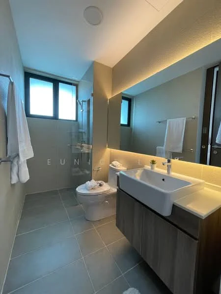 Bathroom features: single-sink vanity with wood cabinet, white ceramic sink, chrome basin mixer faucet, mirror above vanity, walk-in shower with glass enclosure, rain shower head, one-piece toilet, white towels on towel rack, grey tile flooring, lighted wall feature, window for natural light; style: modern.
