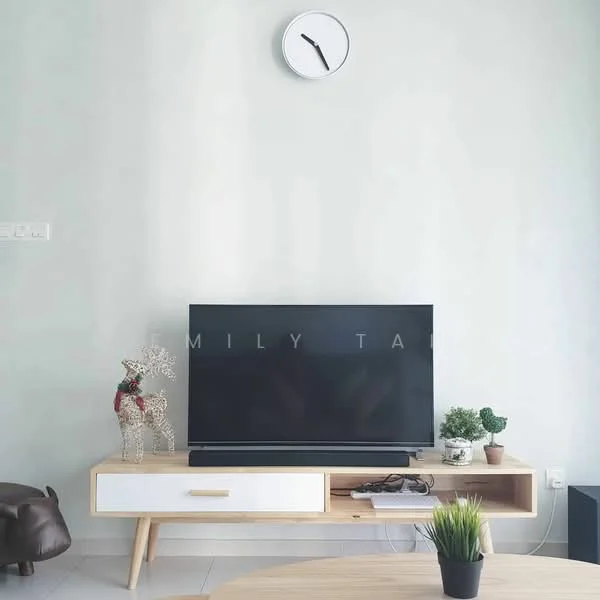 Living features: light grey painted walls, white ceiling, wooden TV console with white drawer, black flat-screen TV, decorative reindeer figurine, small potted plant, round coffee table, green plant in ceramic pot, clock on wall, tile flooring; style: modern.