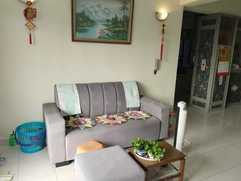 Living features: grey fabric sofa, decorative cushions, wooden coffee table, indoor plant on table, wall-mounted light fixture, framed landscape painting, white tiled flooring, wall decorations with red tassels, basket for storage; style: modern.