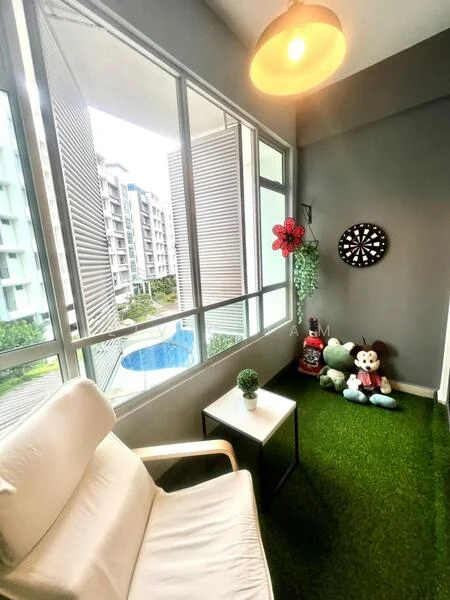 Room features: floor-to-ceiling windows, grey painted walls, artificial grass flooring, hanging pendant light, decorative wall flower, dartboard, small side table, white armchair, stuffed toys; style: modern; view: pool.