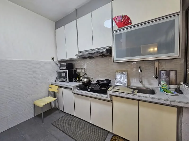 Kitchen features: white upper cabinets, cream lower cabinets, stainless-steel sink, chrome pull-down faucet, grey countertop, ceramic tile backsplash, built-in microwave, freestanding range oven, black cookware on stove, yellow chair, grey floor mat, wall-mounted cabinet, recessed lighting; style: modern.