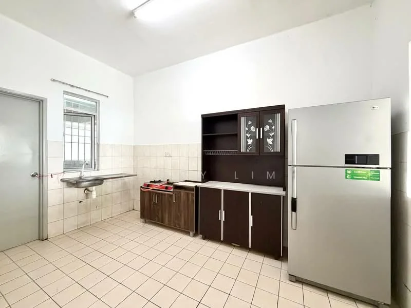 Kitchen features: single-bowl stainless-steel sink, chrome faucet, brown wooden cabinetry, white countertop, stainless-steel fridge, tile backsplash, cream tiled flooring, wall-mounted shelving, window with metal grille, light fixture on ceiling.