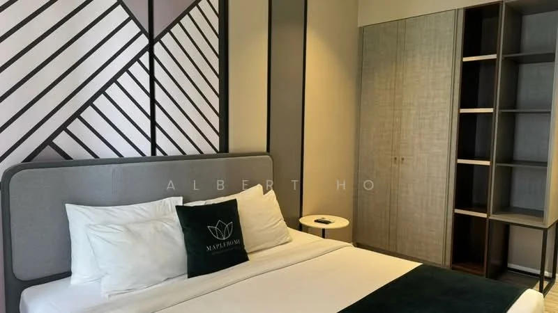 Bedroom features: king-size bed with upholstered headboard, white bedding, decorative green throw pillow, nightstand with lamp, built-in wardrobe with sliding doors, geometric accent wall with black and beige patterns, wooden flooring, wall-mounted decor, window with natural light; style: modern.