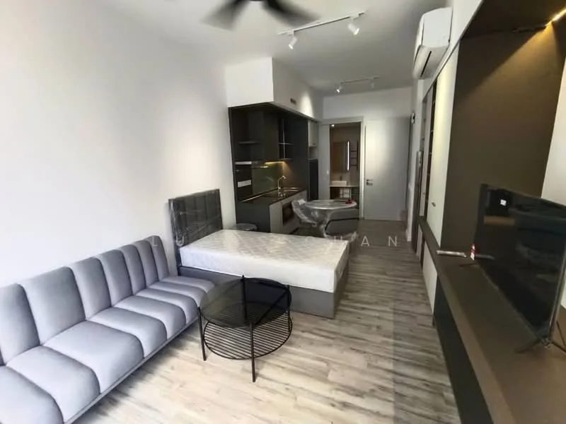 Living features: 3-seater fabric sofa in grey, round coffee table with black metal base, wall-mounted TV, built-in cabinetry with dark finish, kitchenette with countertop, refrigerator, wooden flooring, ceiling fan, air conditioning unit, light fixtures, neutral wall color, open layout; style: modern. Room features: queen-size bed, bed frame, light-colored walls, doorway leading to another room.