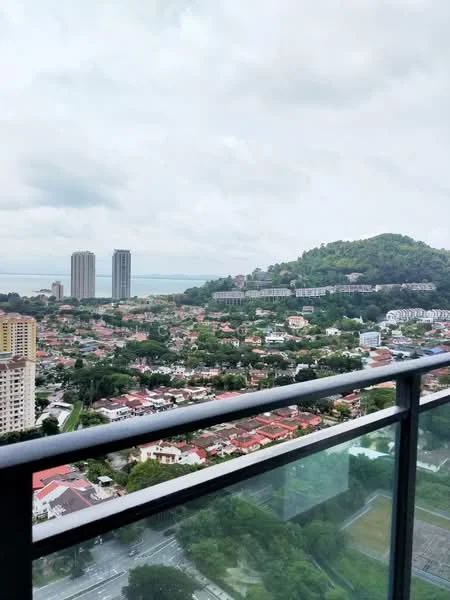 Exterior type: high-rise condominium; features: city skyline view, surrounded by greenery, multiple high-rise buildings, hills in the background, urban residential area, balcony railing visible; style: modern.