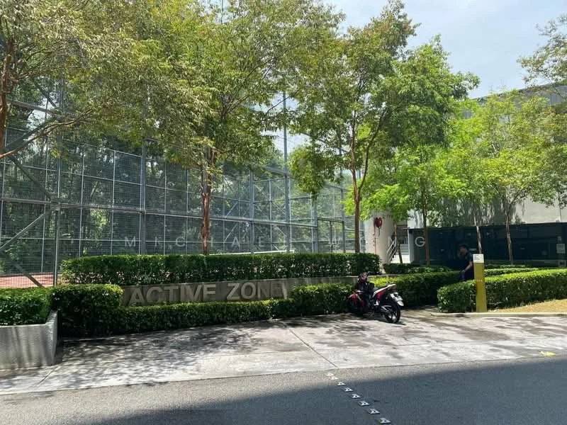 Exterior type: clubhouse; features: manicured hedges, paved driveway, fenced area, surrounding trees, signage with 'ACTIVE ZONE', visible parking area, landscape greenery; style: modern.