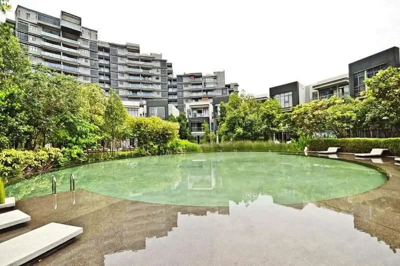 Exterior type: high-rise condominium; features: infinity pool, landscaped garden, surrounding greenery, modern architecture, water feature, pool deck with loungers, multiple storeys, glass facade, paved walkway; style: modern.