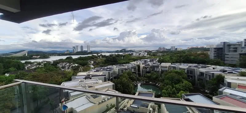 Exterior type: high-rise condominium; features: glass balcony railing, landscaped gardens, infinity pool visible, city skyline in background, surrounded by greenery, waterfront view, modern architectural design, multiple low-rise buildings in foreground; style: modern.